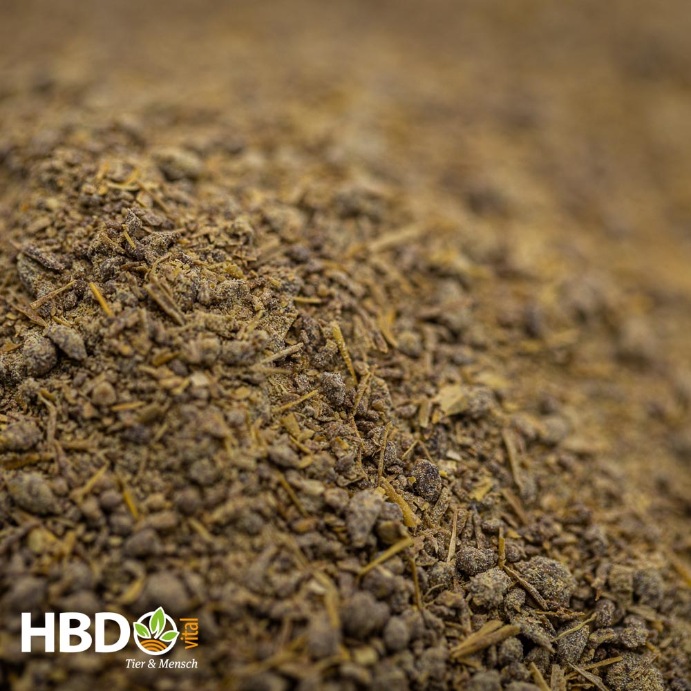Foto von HBD’s Mytox - Eine Nahaufnahme von zeigt braunes Pulver mit feinen und gröberen Bestandteilen.